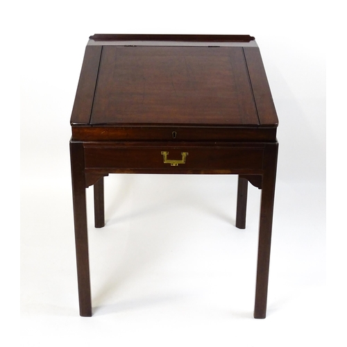 1552 - An early 19thC mahogany campaign style writing desk / clerks desk with a hinged lid and single short... 