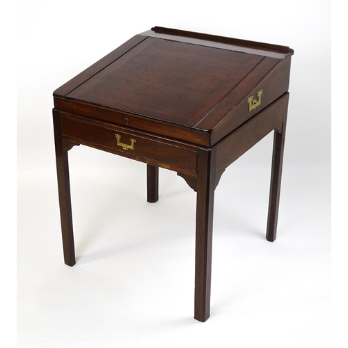 1552 - An early 19thC mahogany campaign style writing desk / clerks desk with a hinged lid and single short... 