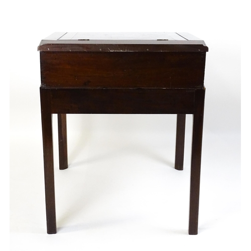 1552 - An early 19thC mahogany campaign style writing desk / clerks desk with a hinged lid and single short... 