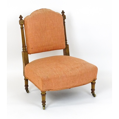 1573 - An early 20thC side chair with turned, fluted uprights, stuffed backrest and sprung seat raised on t... 