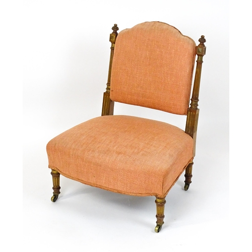 1573 - An early 20thC side chair with turned, fluted uprights, stuffed backrest and sprung seat raised on t... 