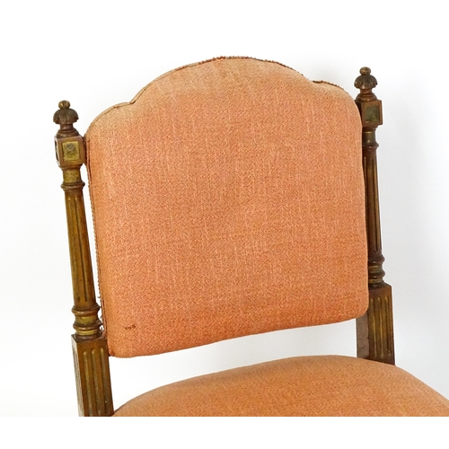 1573 - An early 20thC side chair with turned, fluted uprights, stuffed backrest and sprung seat raised on t... 