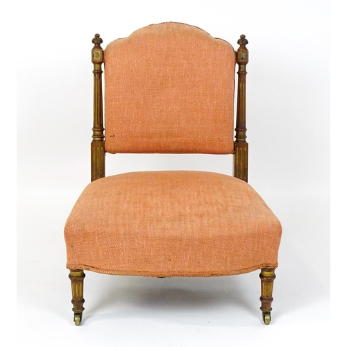 1573 - An early 20thC side chair with turned, fluted uprights, stuffed backrest and sprung seat raised on t... 