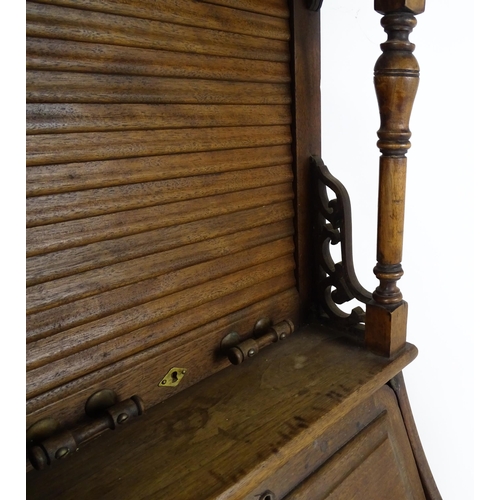 1444 - A late 19thC oak dentist cabinet in the manner of Harvard & Co. The cabinet having a mirrored top se... 