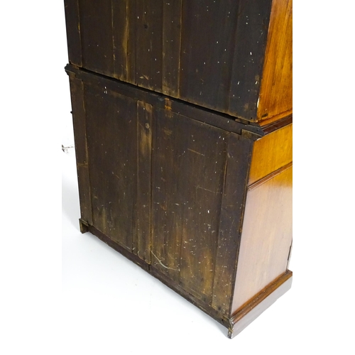 1445 - A Victorian mahogany bookcase with a moulded cornice above a glazed top and four adjustable shelves,... 