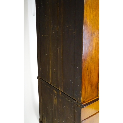 1445 - A Victorian mahogany bookcase with a moulded cornice above a glazed top and four adjustable shelves,... 