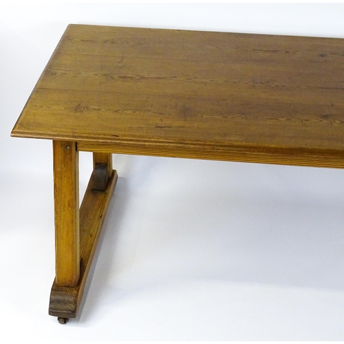 1453 - An early 20thC Heals style pine dining table with a rectangular moulded top above four straight legs... 