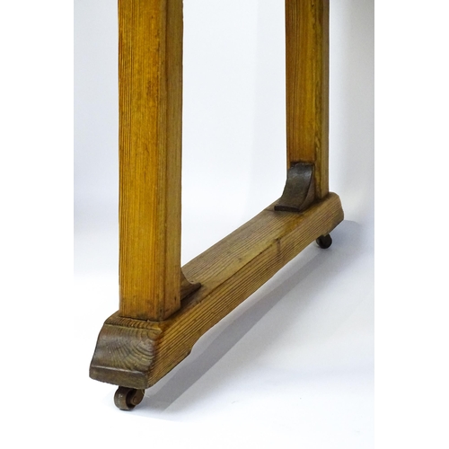 1453 - An early 20thC Heals style pine dining table with a rectangular moulded top above four straight legs... 