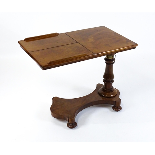 1471 - A Victorian mahogany reading table / invalid table, with an adjustable top having two adjustable slo... 