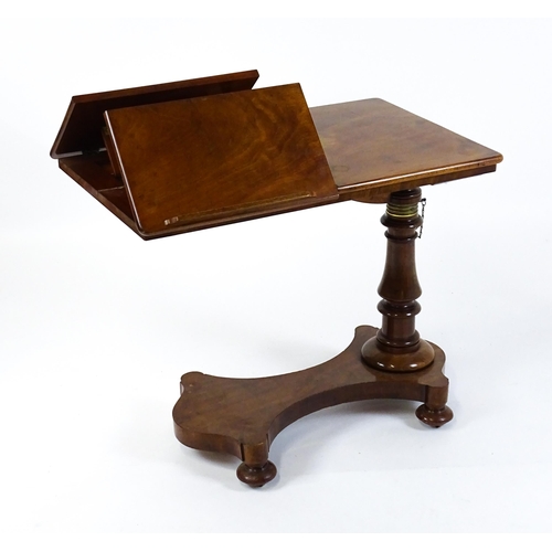 1471 - A Victorian mahogany reading table / invalid table, with an adjustable top having two adjustable slo... 