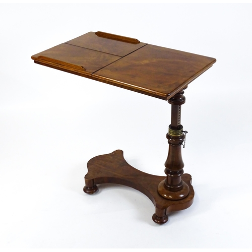 1471 - A Victorian mahogany reading table / invalid table, with an adjustable top having two adjustable slo... 