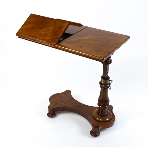 1471 - A Victorian mahogany reading table / invalid table, with an adjustable top having two adjustable slo... 