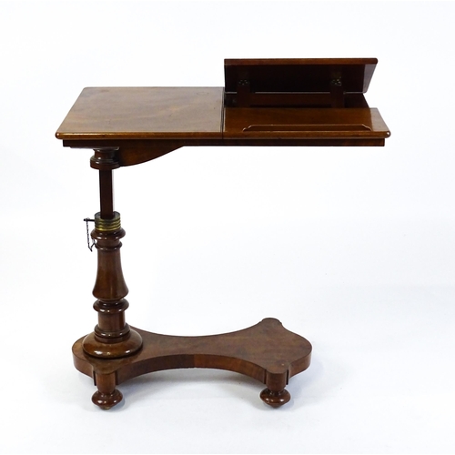 1471 - A Victorian mahogany reading table / invalid table, with an adjustable top having two adjustable slo... 