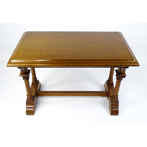 1479 - A Victorian Gothic oak table with a double moulded top edge above four turned columns with composite... 