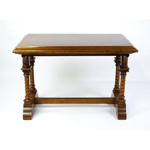 1479 - A Victorian Gothic oak table with a double moulded top edge above four turned columns with composite... 