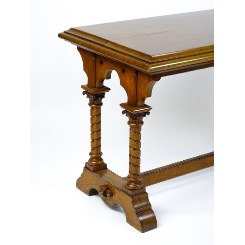 1479 - A Victorian Gothic oak table with a double moulded top edge above four turned columns with composite... 