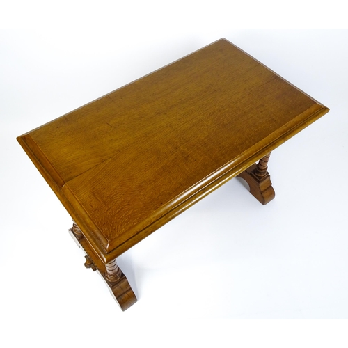 1479 - A Victorian Gothic oak table with a double moulded top edge above four turned columns with composite... 