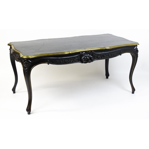 1486 - A late 19thC / early 20thC Louis XV style table with an ebonised finish and a brass rim, the table r... 