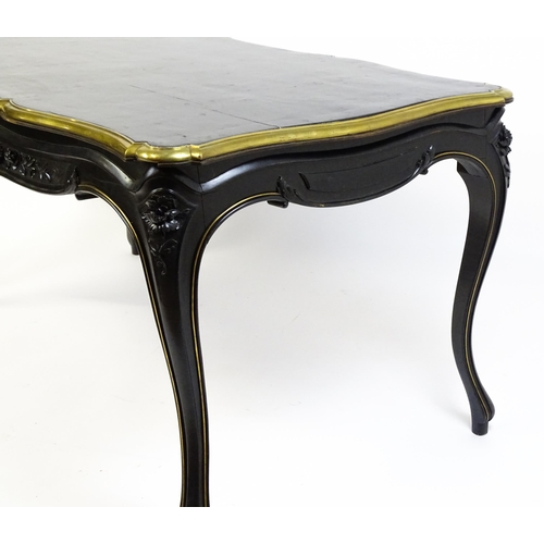 1486 - A late 19thC / early 20thC Louis XV style table with an ebonised finish and a brass rim, the table r... 