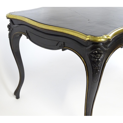 1486 - A late 19thC / early 20thC Louis XV style table with an ebonised finish and a brass rim, the table r... 