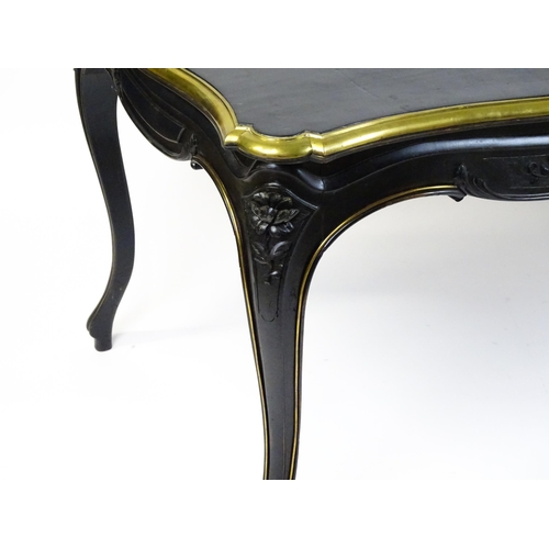 1486 - A late 19thC / early 20thC Louis XV style table with an ebonised finish and a brass rim, the table r... 