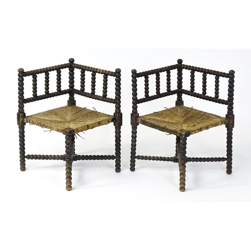 1492 - A pair of late 19thC English corner chairs with bobbin turned turning and rush seats. 23