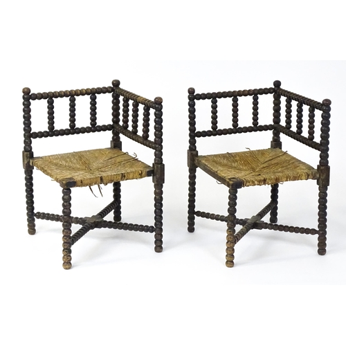 1492 - A pair of late 19thC English corner chairs with bobbin turned turning and rush seats. 23