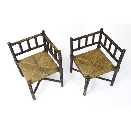 1492 - A pair of late 19thC English corner chairs with bobbin turned turning and rush seats. 23