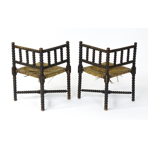 1492 - A pair of late 19thC English corner chairs with bobbin turned turning and rush seats. 23