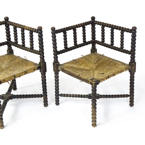 1492 - A pair of late 19thC English corner chairs with bobbin turned turning and rush seats. 23