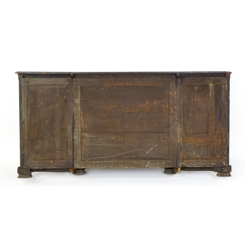 1505 - A Victorian walnut credenza with three open bookshelves and two mirrored back panels. The cabinet ha... 