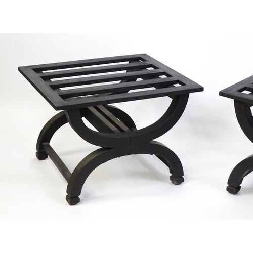 1521 - A pair of ebonised oak luggage racks / table / stools with slatted tops and raised on x-frame bases.... 