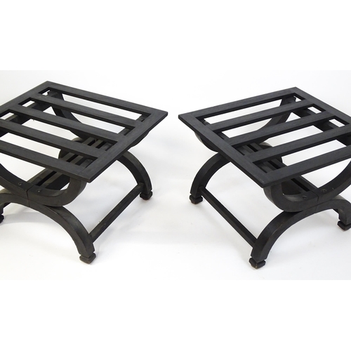 1521 - A pair of ebonised oak luggage racks / table / stools with slatted tops and raised on x-frame bases.... 