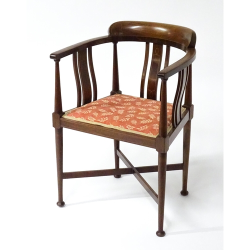 1527 - An Edwardian mahogany tub chair in the manner of E.A Taylor. The chair having boxwood inlaid decorat... 