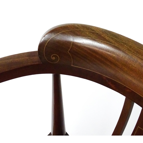 1527 - An Edwardian mahogany tub chair in the manner of E.A Taylor. The chair having boxwood inlaid decorat... 