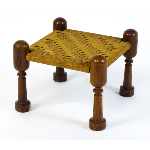 1535 - A mid 20thC Anglo-Indian style stool with four turned rosewood legs and a woven seat. 18