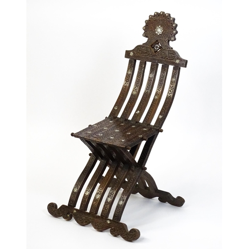 1542 - A late 19thC Moorish style folding chair with mother of pearl decoration. 15