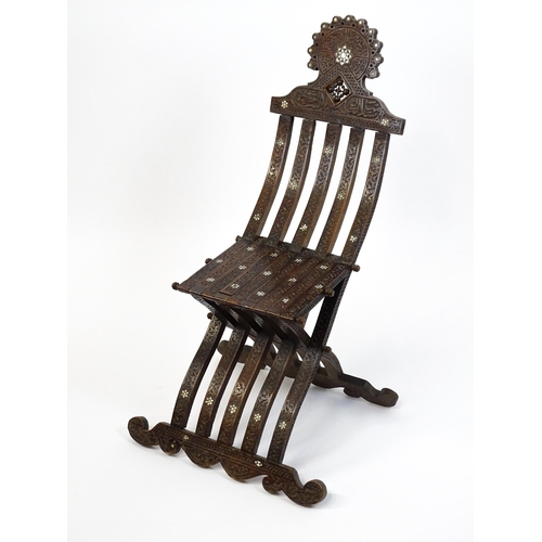 1542 - A late 19thC Moorish style folding chair with mother of pearl decoration. 15