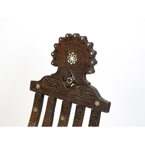 1542 - A late 19thC Moorish style folding chair with mother of pearl decoration. 15