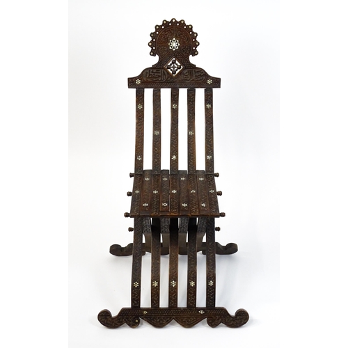 1542 - A late 19thC Moorish style folding chair with mother of pearl decoration. 15