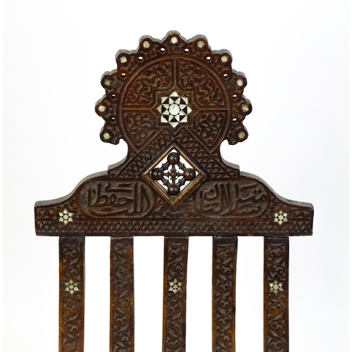 1542 - A late 19thC Moorish style folding chair with mother of pearl decoration. 15