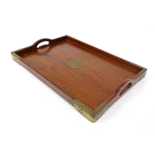 1094 - Three 20thC Oriental graduated hardwood trays with brass mounts. Largest approx. 20 1/4