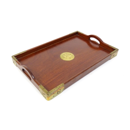 1094 - Three 20thC Oriental graduated hardwood trays with brass mounts. Largest approx. 20 1/4