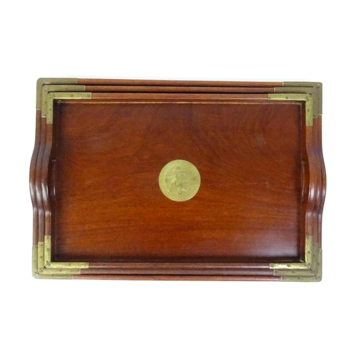 1094 - Three 20thC Oriental graduated hardwood trays with brass mounts. Largest approx. 20 1/4