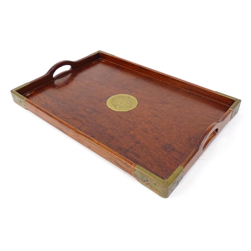 1094 - Three 20thC Oriental graduated hardwood trays with brass mounts. Largest approx. 20 1/4