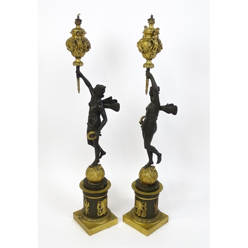 1234 - A large pair of 19thC cast bronze sculptural lamps, each modelled as a Classical female figure holdi... 