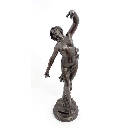 1240 - A large 20thC bronzed resin sculpture depicting a dancing female nude with cymbals, standing on a ru... 