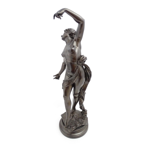 1240 - A large 20thC bronzed resin sculpture depicting a dancing female nude with cymbals, standing on a ru... 