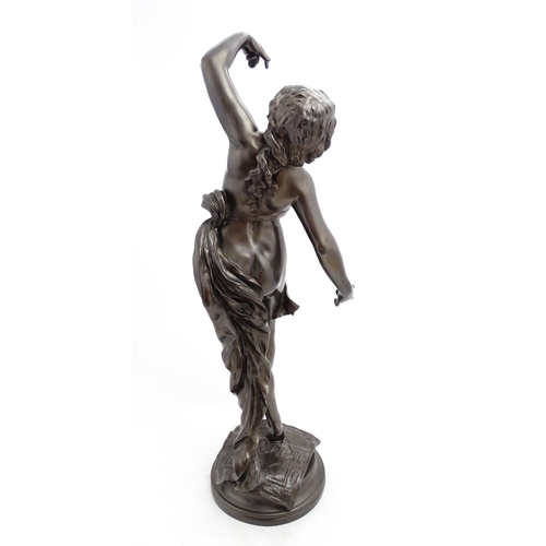 1240 - A large 20thC bronzed resin sculpture depicting a dancing female nude with cymbals, standing on a ru... 