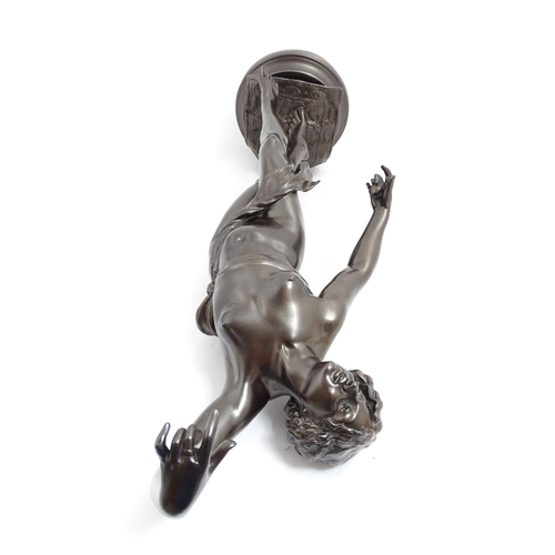 1240 - A large 20thC bronzed resin sculpture depicting a dancing female nude with cymbals, standing on a ru... 